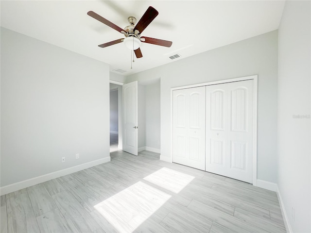 unfurnished bedroom featuring a closet and ceiling fan