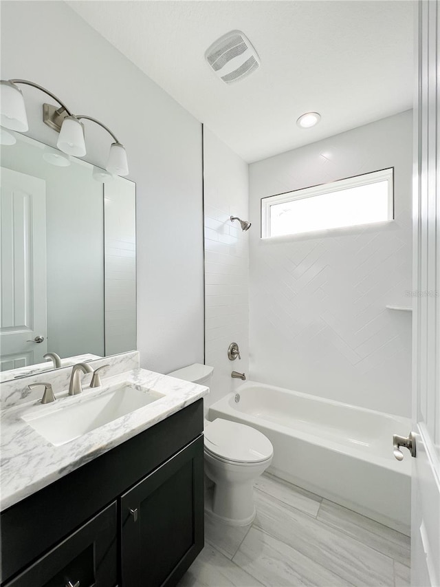 full bathroom with vanity, toilet, tile patterned floors, and shower / bath combination