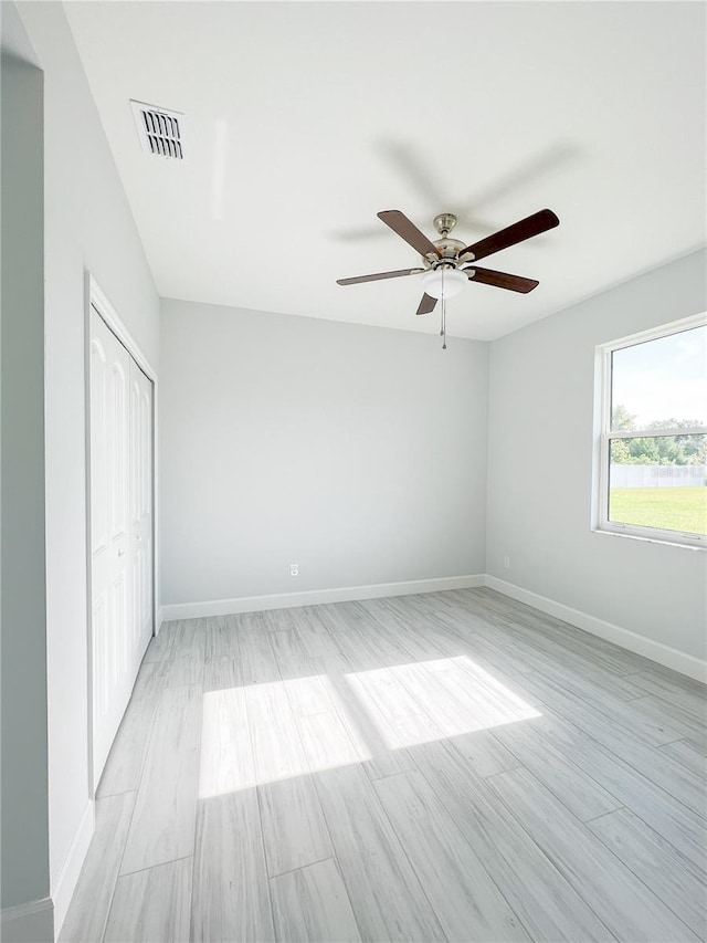 spare room with ceiling fan