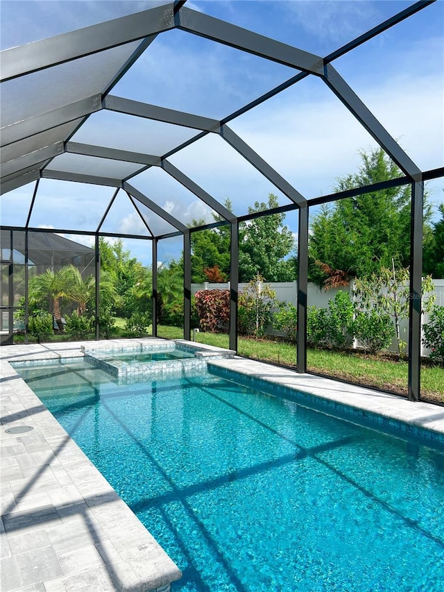 view of swimming pool with glass enclosure