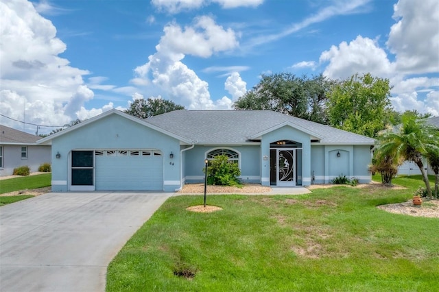 ranch-style home featuring a garage, driveway, and a front lawn