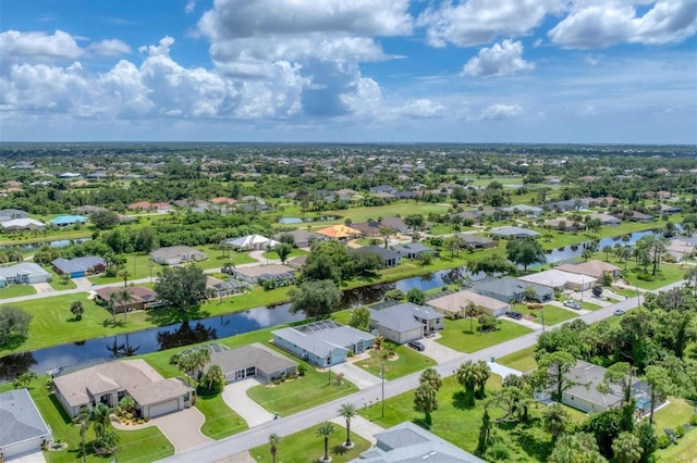 drone / aerial view with a residential view and a water view