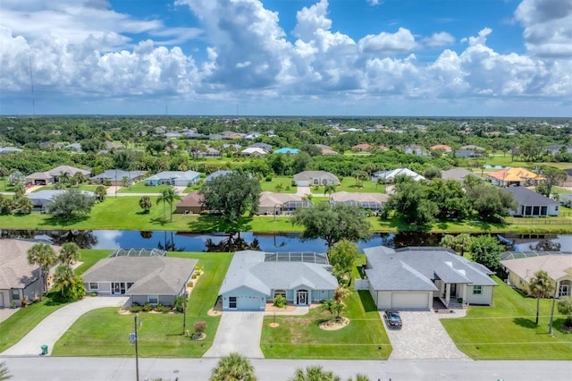 drone / aerial view featuring a water view and a residential view