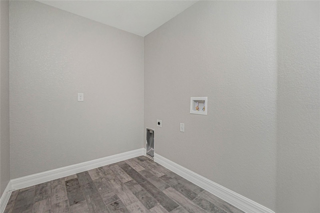 laundry area with wood finished floors, baseboards, laundry area, electric dryer hookup, and washer hookup