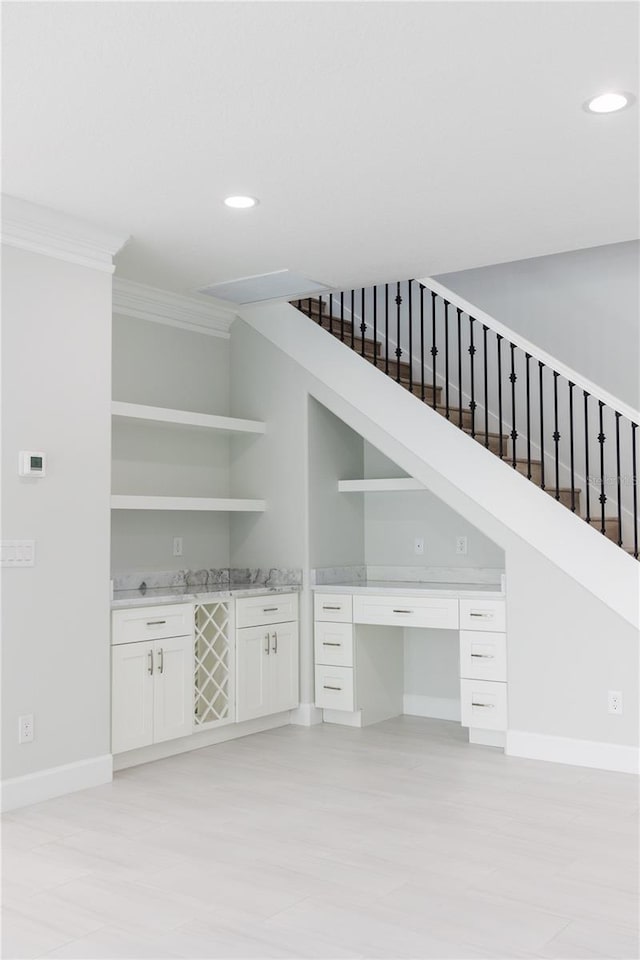 interior space with crown molding