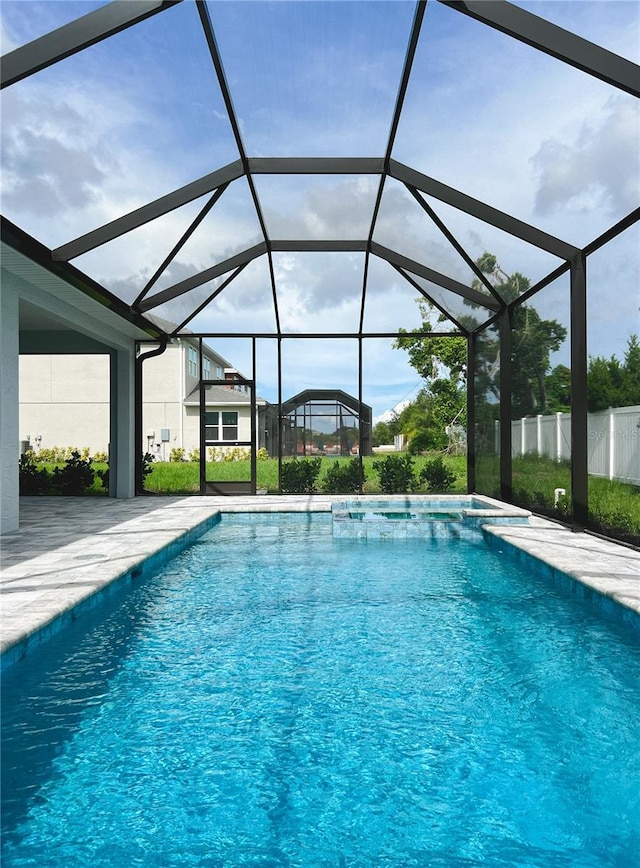 view of pool with a lanai