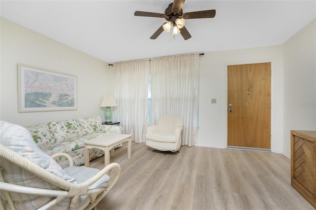 3 Quails Run Blvd Unit 8, Englewood, FL 34223 - living room featuring ceiling fan, baseboards, and light wood-type flooring