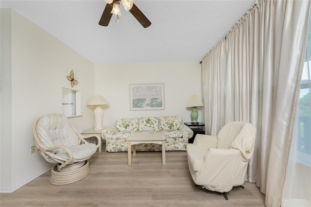 3 Quails Run Blvd Unit 8, Englewood, FL 34223 - sitting room featuring a ceiling fan, baseboards, wood finished floors, and a textured ceiling