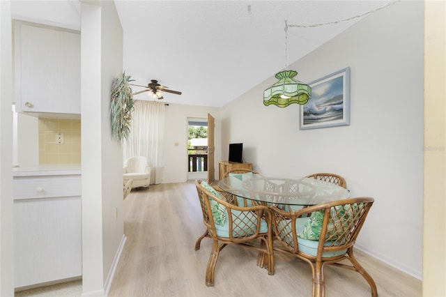 3 Quails Run Blvd Unit 8, Englewood, FL 34223 - dining area with light wood-type flooring, a ceiling fan, vaulted ceiling, and baseboards