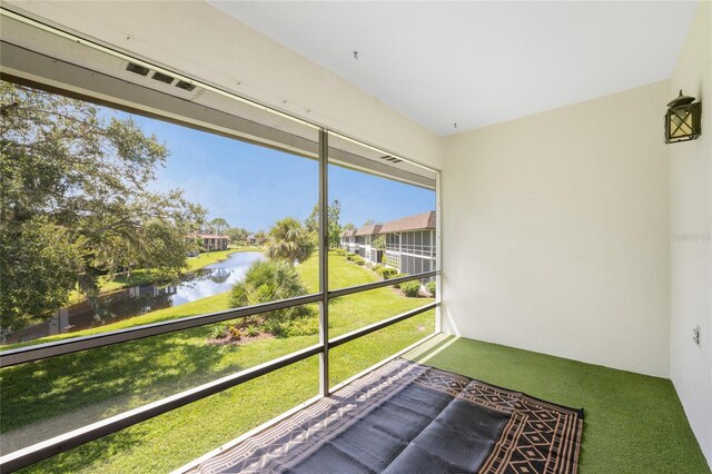 3 Quails Run Blvd Unit 8, Englewood, FL 34223 - unfurnished sunroom featuring a water view