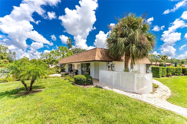 view of front of property with a front lawn