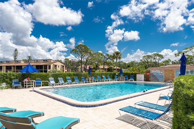 3 Quails Run Blvd Unit 8, Englewood, FL 34223 - community pool with fence and a patio
