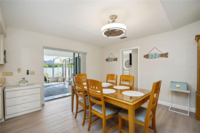 dining area featuring light wood-type flooring