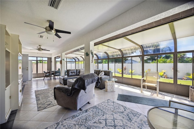 sunroom with ceiling fan