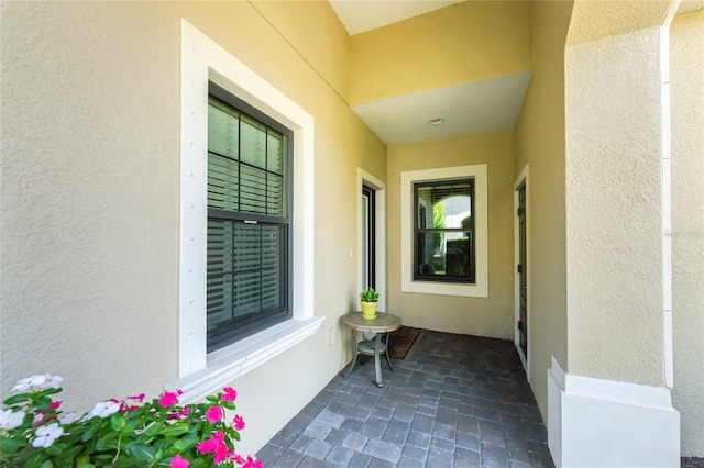 property entrance featuring stucco siding