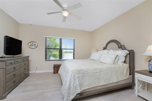 bedroom with ceiling fan and light hardwood / wood-style floors