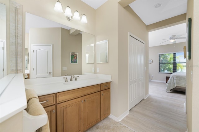 bathroom with ceiling fan, wood-type flooring, and vanity