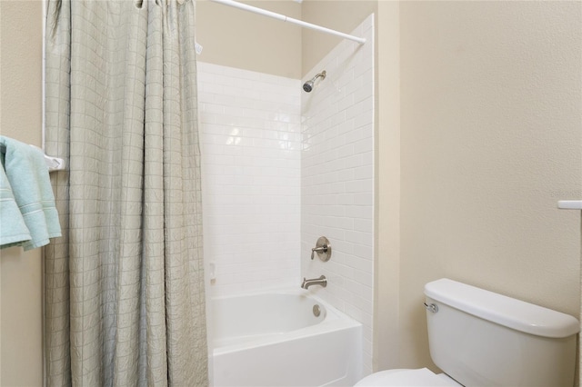 full bath featuring toilet and shower / bath combination with curtain