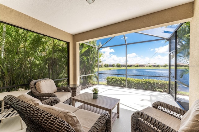 sunroom / solarium with a wealth of natural light and a water view