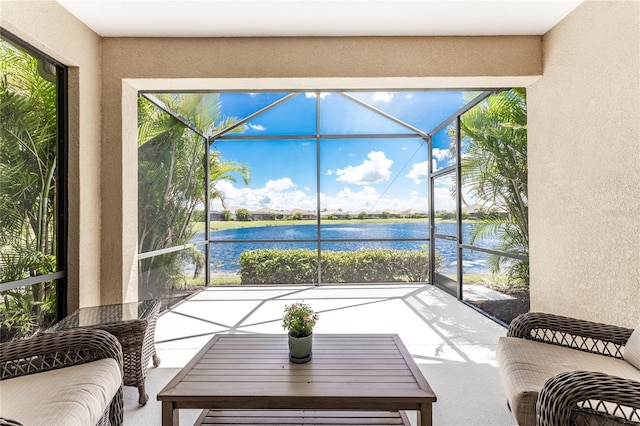 sunroom / solarium with a water view and plenty of natural light