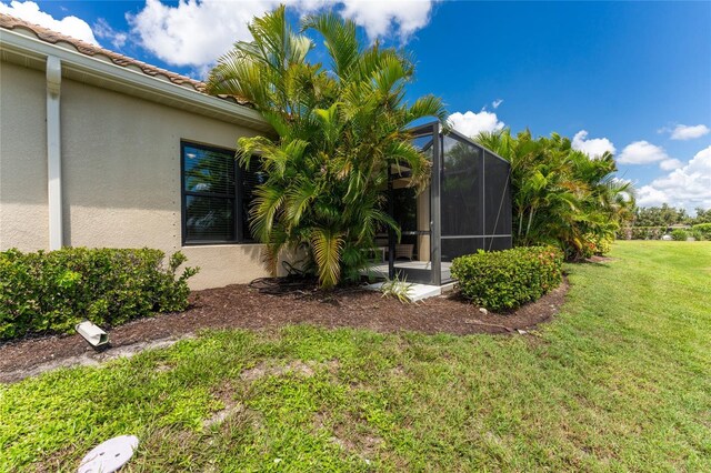 view of yard with a lanai