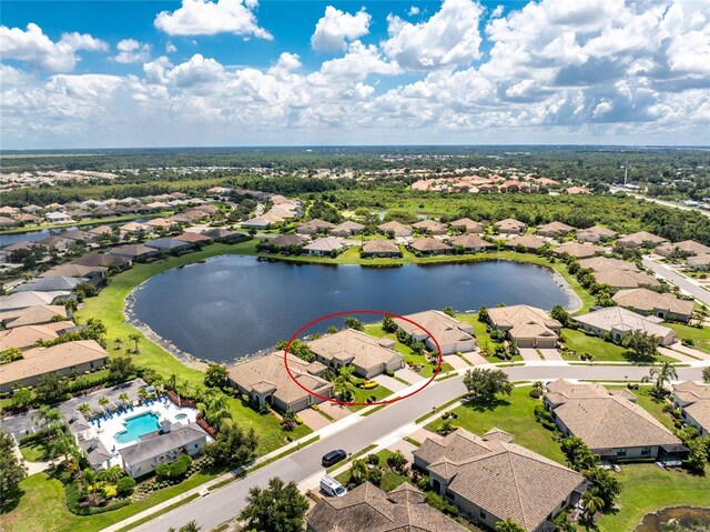 birds eye view of property with a water view