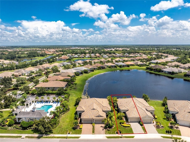 bird's eye view featuring a water view and a residential view