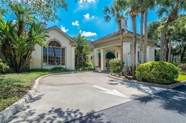 view of property with concrete driveway