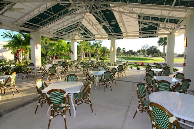 view of patio / terrace with a ceiling fan, outdoor dining space, and a gazebo