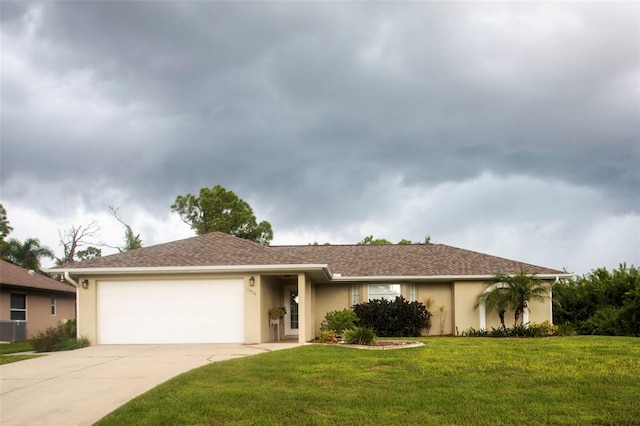 ranch-style house featuring a garage and a front lawn