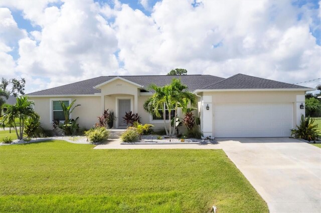 ranch-style house with a front lawn and a garage