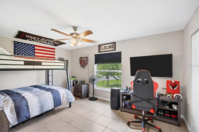 bedroom featuring tile patterned flooring and ceiling fan