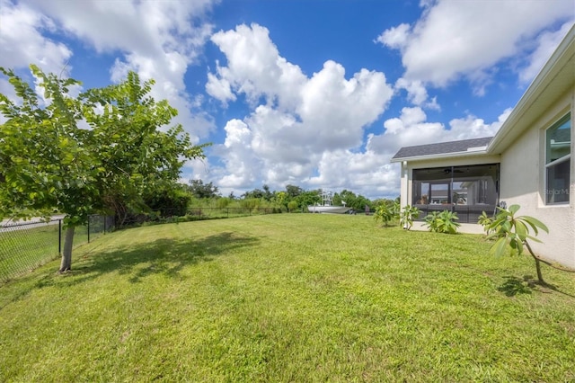 view of yard featuring a sunroom