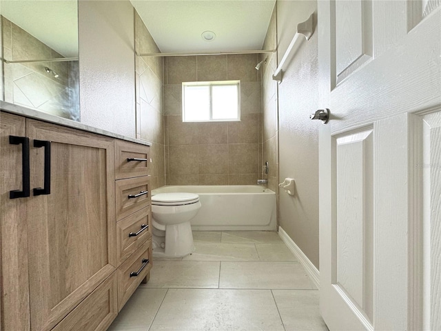 full bathroom featuring tiled shower / bath, tile patterned floors, toilet, and vanity