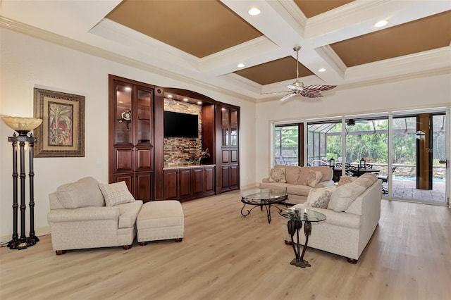 living room featuring coffered ceiling, ornamental molding, beamed ceiling, and light hardwood / wood-style floors