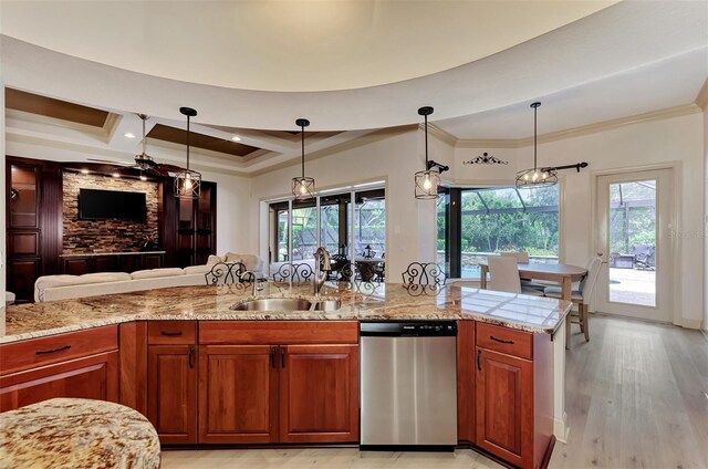 kitchen featuring dishwasher, light hardwood / wood-style flooring, decorative light fixtures, light stone countertops, and sink