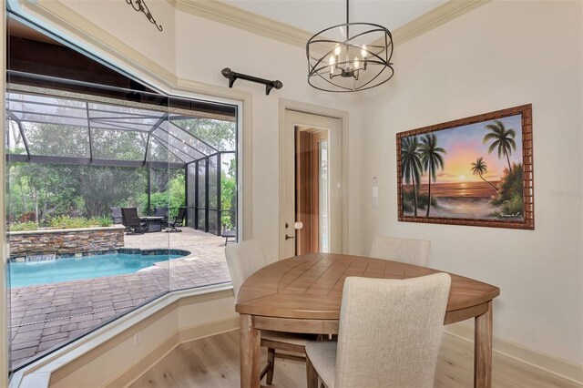 dining room with crown molding and hardwood / wood-style flooring