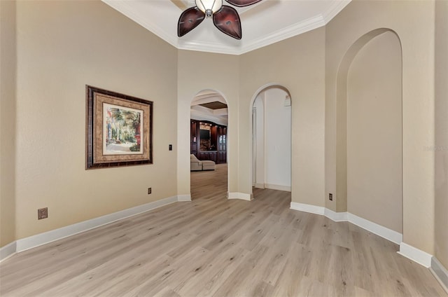 unfurnished room with ornamental molding, ceiling fan, and light hardwood / wood-style floors