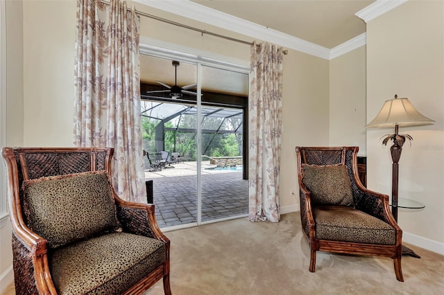 living area featuring carpet floors, crown molding, baseboards, and a sunroom