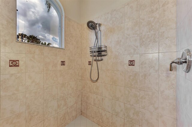 bathroom with a tile shower