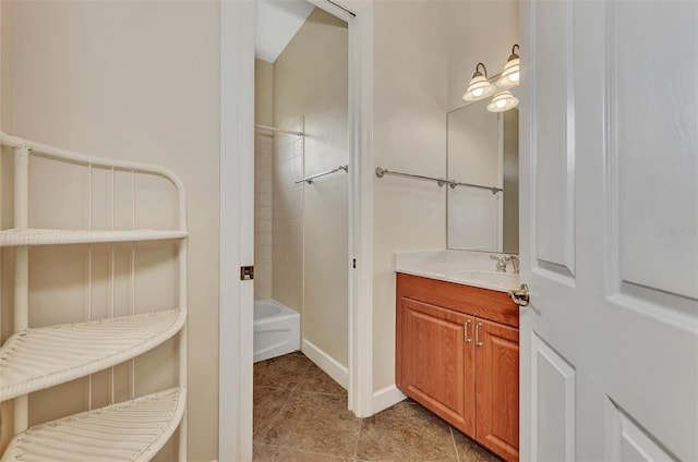 bathroom with vanity, tile patterned floors, and shower / washtub combination