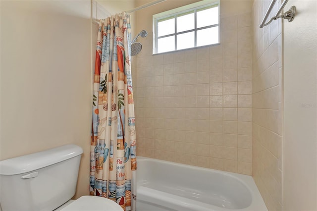 bathroom featuring toilet and shower / tub combo