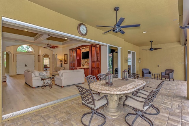 view of patio / terrace with outdoor dining space, a ceiling fan, and outdoor lounge area