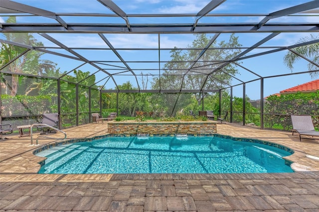 view of pool featuring a patio area, pool water feature, and a lanai