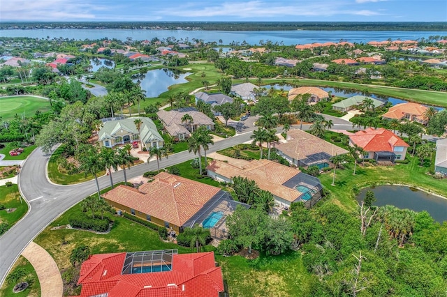 bird's eye view with golf course view, a residential view, and a water view