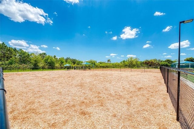 view of yard featuring an enclosed area and fence