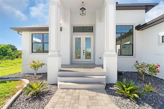 property entrance featuring french doors