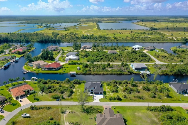 aerial view featuring a water view and a residential view