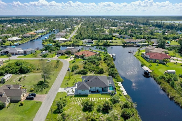 aerial view with a residential view and a water view