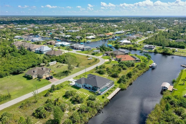 bird's eye view featuring a water view and a residential view